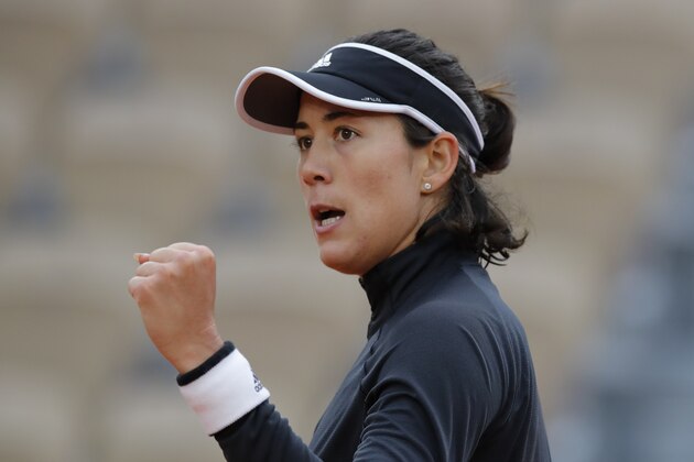 Spain's Garbine Muguruza clenches his fist after scoring a point against Tamara Zidansek of Slovenia in the first round match of the French Open tennis tournament at the Roland Garros stadium in Paris, France, Monday, Sept. 28, 2020. (AP Photo/Christophe Ena)