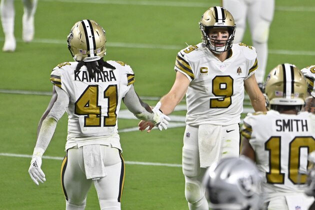 New Orleans Saints quarterback Drew Brees (9) celebrates after running back Alvin Kamara (41) scored a touchdown against the Las Vegas Raiders during the second half of an NFL football game, Monday, Sept. 21, 2020, in Las Vegas. (AP Photo/David Becker)