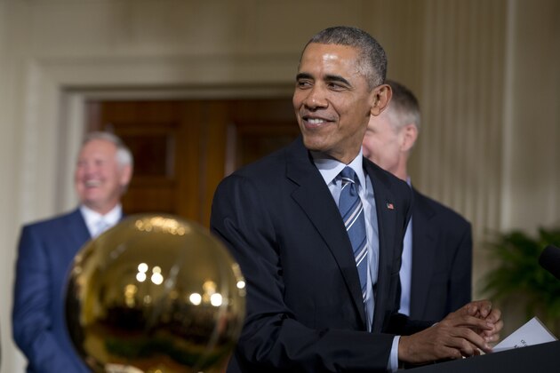 President Barack Obama looks back to the 2015 NBA Champion Golden State Warriors basketball team during a ceremony to honor them in the East Room of the White House, in Washington, Thursday, Feb. 4, 2016. At left in the background is Golden State Warriors basketball team Executive Board member Jerry West in the foreground is the Larry O'Brien Championship Trophy. (AP Photo/Carolyn Kaster) President Barack Obama looks back to the 2015 NBA Champion Golden State Warriors basketball team during a ceremony to honor them in the East Room of the White House, in Washington, Thursday, Feb. 4, 2016. At left in the background is Golden State Warriors basketball team Executive Board member Jerry West in the foreground is the Larry O'Brien Championship Trophy. (AP Photo/Carolyn Kaster)