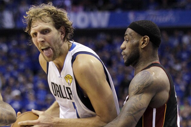 Dallas Mavericks' Dirk Nowitzki tries to drive past Miami Heat's LeBron James during the second half of Game 5 of the NBA Finals basketball game Thursday, June 9, 2011, in Dallas. (AP Photo/Mark Humphrey)