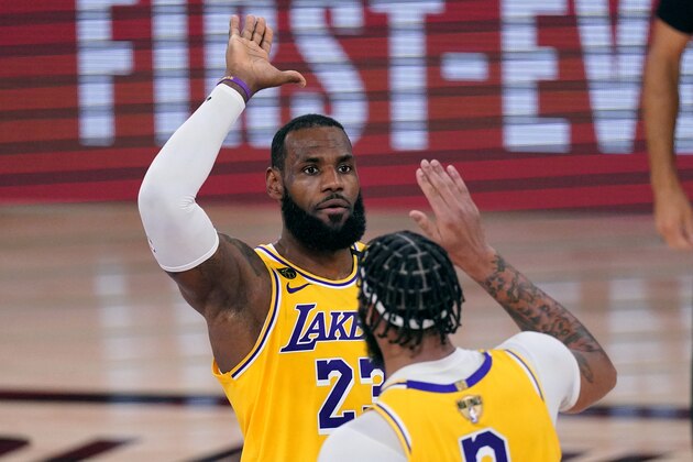 Los Angeles Lakers' LeBron James (23) high-fives Anthony Davis during the second half of Game 1 of basketball's NBA Finals Wednesday, Sept. 30, 2020, in Lake Buena Vista, Fla. (AP Photo/Mark J. Terrill) Los Angeles Lakers' LeBron James (23) high-fives Anthony Davis during the second half of Game 1 of basketball's NBA Finals Wednesday, Sept. 30, 2020, in Lake Buena Vista, Fla. (AP Photo/Mark J. Terrill)