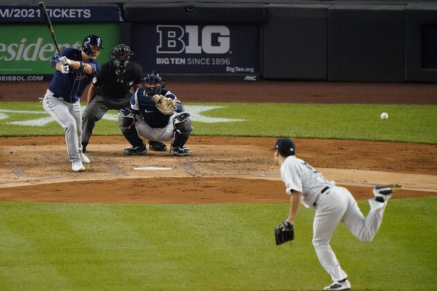 Tampa Bay Rays Ji-Man Choi, left, hits a single off New York Yankees starting pitcher Masahiro Tanaka during the fourth inning of a baseball game, Tuesday, Sept. 1, 2020, at Yankee Stadium in New York. (AP Photo/Kathy Willens)