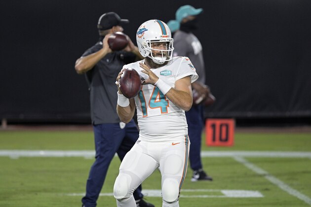 Miami Dolphins quarterback Ryan Fitzpatrick (14) warms up before an NFL football game against the Jacksonville Jaguars, Thursday, Sept. 24, 2020, in Jacksonville, Fla. (AP Photo/Phelan M. Ebenhack)