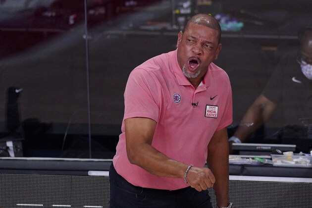 Los Angeles Clippers head coach Doc Rivers, right, complains about a call during the first half of an NBA conference semifinal playoff basketball game against the Denver Nuggets, Wednesday, Sept. 9, 2020, in Lake Buena Vista, Fla. (AP Photo/Mark J. Terrill) Los Angeles Clippers head coach Doc Rivers, right, complains about a call during the first half of an NBA conference semifinal playoff basketball game against the Denver Nuggets, Wednesday, Sept. 9, 2020, in Lake Buena Vista, Fla. (AP Photo/Mark J. Terrill)
