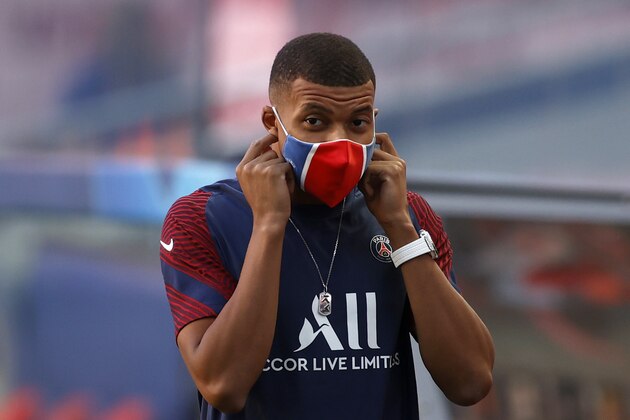 PSG's Kylian Mbappe arrives on the field for a training session at the Luz stadium in Lisbon, Saturday Aug. 22, 2020. PSG will play Bayern Munich in the Champions League final soccer match on Sunday. (Matthew Childs/Pool via AP)