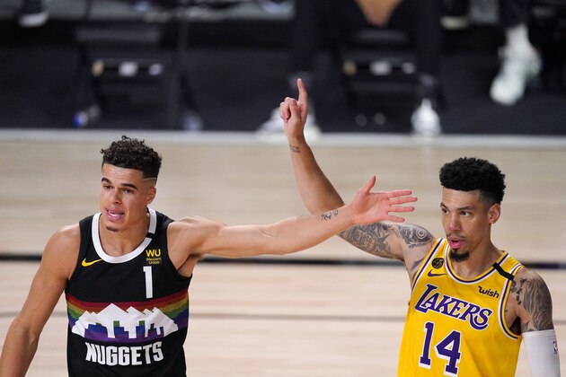 Denver Nuggets' Michael Porter Jr. (1) and Los Angeles Lakers' Danny Green (14) play during the second half of an NBA conference final playoff basketball game Thursday, Sept. 24, 2020, in Lake Buena Vista, Fla. (AP Photo/Mark J. Terrill)