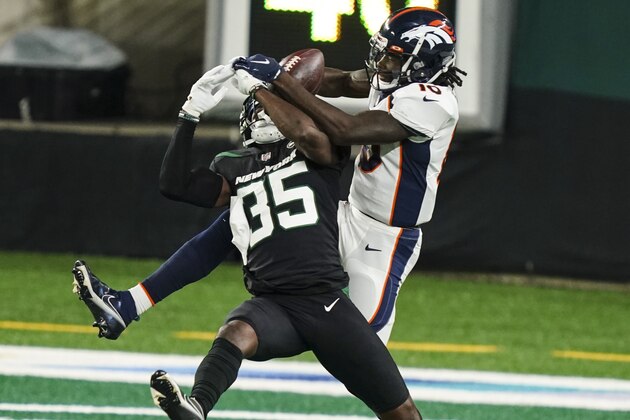 Denver Broncos wide receiver Jerry Jeudy (10) fights for control of the ball withNew York Jets cornerback Pierre Desir (35) during the first half of an NFL football game Thursday, Oct. 1, 2020, in East Rutherford, N.J. Jeudy completed the pass for a touchdown. (AP Photo/John Minchillo) Denver Broncos wide receiver Jerry Jeudy (10) fights for control of the ball withNew York Jets cornerback Pierre Desir (35) during the first half of an NFL football game Thursday, Oct. 1, 2020, in East Rutherford, N.J. Jeudy completed the pass for a touchdown. (AP Photo/John Minchillo)