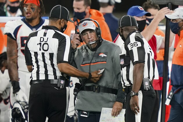 Denver Broncos head coach Vic Fangio talks to officials during the first half of an NFL football game against the New York Jets Thursday, Oct. 1, 2020, in East Rutherford, N.J. (AP Photo/John Minchillo)