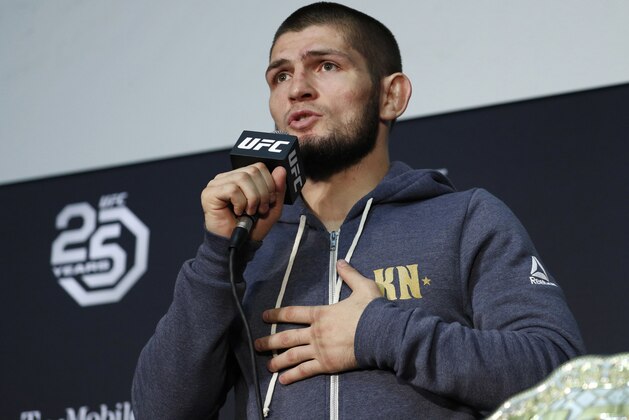 FILE - In this Saturday, Oct. 6, 2018 file photo Khabib Nurmagomedov speaks at a news conference after the UFC 229 mixed martial arts event in Las Vegas. UFC champion Khabib Nurmagomedov is probably the best-known Muslim athlete in Russia, and he's rapidly becoming a leading conservative voice at home. When a National Guardsman was killed while apparently trying to break up a fight outside an establishment variously described as a cafe and nightclub early Sunday morning, Nurmagomedov called for a crackdown on the local nightlife in his mostly-Muslim home region of Dagestan.(AP Photo/John Locher, File)