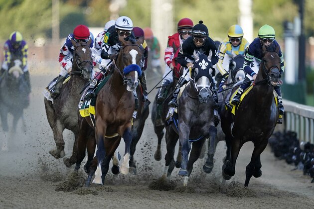 John Velazquez rides Authentic, front left, as they head into turn one in the 146th running of the Kentucky Derby horse race at Churchill Downs, Saturday, Sept. 5, 2020, in Louisville, Ky. (AP Photo/Mark Humphrey)