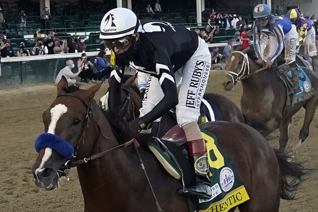 FILE - Jockey John Velazquez rides Authentic to win the 146th running of the Kentucky Derby at Churchill Downs, Saturday, Sept. 5, 2020, in Louisville, Ky. Belmont Stakes winner Tiz the Law won’t run in next month’s Preakness, spoiling what would have been a highly anticipated rematch with Kentucky Derby winner Authentic. The Preakness on Oct. 3 at Pimlico concludes this year’s reconfigured Triple Crown series, which was run out of order because of the coronavirus pandemic. (AP Photo/Jeff Roberson, File)