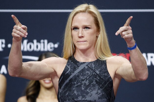 Holly Holm poses during a ceremonial weigh-in for the UFC 246 mixed martial arts bout, Friday, Jan. 17, 2020, in Las Vegas. Holm is scheduled to fight Raquel Pennington in a women's bantamweight bout Saturday in Las Vegas (AP Photo/John Locher)