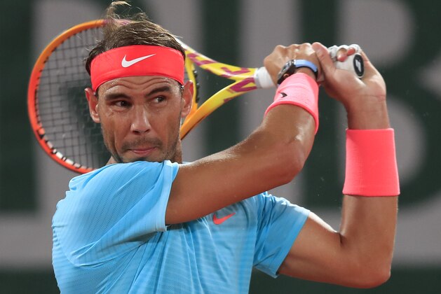 Spain's Rafael Nadal plays a shot against Italy's Stefano Travaglia in the third round match of the French Open tennis tournament at the Roland Garros stadium in Paris, France, Friday, Oct. 2, 2020. (AP Photo/Michel Euler)