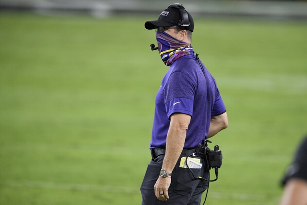 Baltimore Ravens head coach John Harbaugh stands on the field before an NFL football game Kansas City Chiefs, Monday, Sept. 28, 2020, in Baltimore. (AP Photo/Nick Wass)