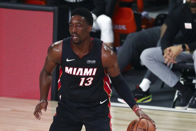Miami Heat forward Bam Adebayo (13) controls the ball against the Milwaukee Bucks during the second half of an NBA basketball game Thursday, Aug. 6, 2020, in Lake Buena Vista, Fla. (Kim Klement/Pool Photo via AP)