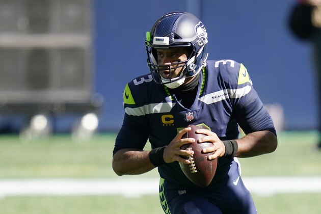 Seattle Seahawks quarterback Russell Wilson drops to pass against the Dallas Cowboys during the first half of an NFL football game, Sunday, Sept. 27, 2020, in Seattle. (AP Photo/Elaine Thompson)