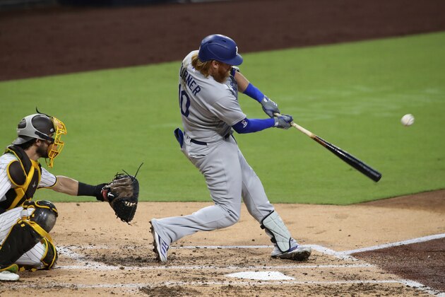 Los Angeles Dodgers' Justin Turner singles to right center against the San Diego Padres in the third inning of a baseball game Tuesday, Sept. 15, 2020, in San Diego. (AP Photo/Derrick Tuskan)