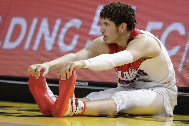 LaMelo Ball of the Illawarra Hawks stretches during their game against the Sydney Kings in the Australian Basketball League in Sydney, Sunday, Nov. 17, 2019. (AP Photo/Rick Rycroft)