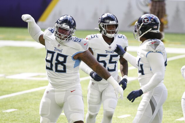 Tennessee Titans defensive tackle Jeffery Simmons (98) celebrates with teammates after a sack during the first half of an NFL football game against the Minnesota Vikings, Sunday, Sept. 27, 2020, in Minneapolis. (AP Photo/Bruce Kluckhohn)