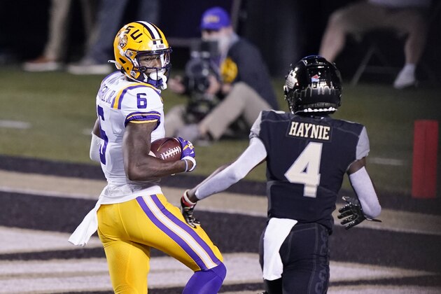 LSU wide receiver Terrace Marshall Jr. (6) looks back at Vanderbilt cornerback Randall Haynie (4) as Marshall scores a touchdown on a 51-yard pass reception in the first half of an NCAA college football game Saturday, Oct. 3, 2020, in Nashville, Tenn. (AP Photo/Mark Humphrey) LSU wide receiver Terrace Marshall Jr. (6) looks back at Vanderbilt cornerback Randall Haynie (4) as Marshall scores a touchdown on a 51-yard pass reception in the first half of an NCAA college football game Saturday, Oct. 3, 2020, in Nashville, Tenn. (AP Photo/Mark Humphrey)