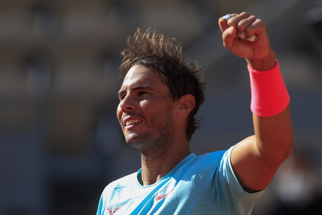 Spain's Rafael Nadal clenches his fist after winning his fourth round match of the French Open tennis tournament against Sebastian Korda of the U.S. in three sets, 6-1, 6-1, 6-2, at the Roland Garros stadium in Paris, France, Sunday, Oct. 4, 2020. (AP Photo/Michel Euler)