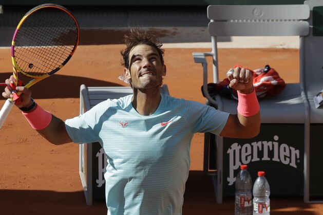 Spain's Rafael Nadal celebrates winning his fourth round match of the French Open tennis tournament against Sebastian Korda of the U.S. in three sets, 6-1, 6-1, 6-2, at the Roland Garros stadium in Paris, France, Sunday, Oct. 4, 2020. (AP Photo/Alessandra Tarantino)