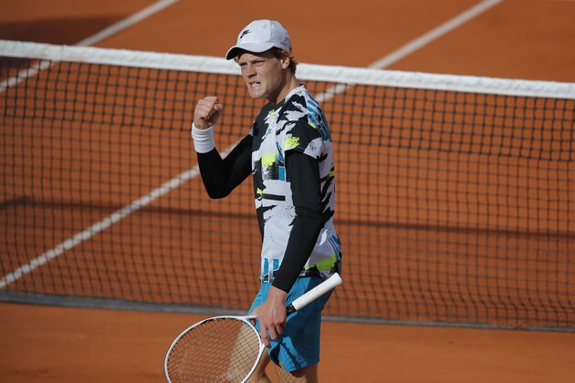 Italy's Jannik Sinner clenches his fist after scoring a point against Germany's Alexander Zverev in the fourth round match of the French Open tennis tournament at the Roland Garros stadium in Paris, France, Sunday, Oct. 4, 2020. (AP Photo/Christophe Ena)