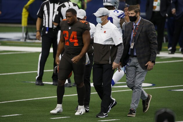 Cleveland Browns running back Nick Chubb (24) is assisted off the field by staff after suffering an unknown injury in the first half of an NFL football game against the Dallas Cowboys in Arlington, Texas, Sunday, Oct. 4, 2020. (AP Photo/Michael Ainsworth) Cleveland Browns running back Nick Chubb (24) is assisted off the field by staff after suffering an unknown injury in the first half of an NFL football game against the Dallas Cowboys in Arlington, Texas, Sunday, Oct. 4, 2020. (AP Photo/Michael Ainsworth)