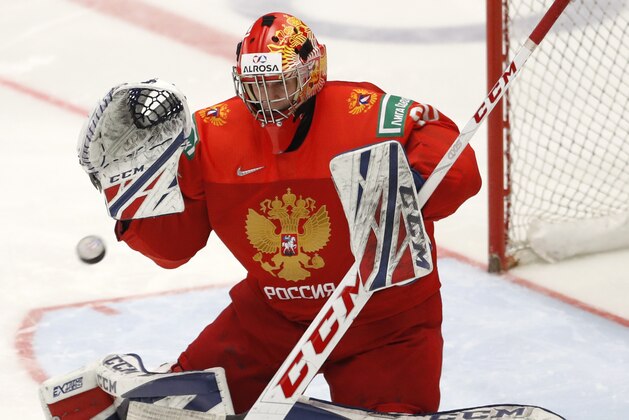 Russia's goaltender Yaroslav Askarov makes a save during the U20 Ice Hockey Worlds semifinal match between Sweden and Russia in Ostrava, Czech Republic, Saturday, Jan. 4, 2020. (AP Photo/Petr David Josek)