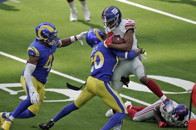 New York Giants wide receiver Golden Tate, right, is tackled by Los Angeles Rams cornerback Jalen Ramsey, center, during the second half of an NFL football game Sunday, Oct. 4, 2020, in Inglewood, Calif. (AP Photo/Jae C. Hong) New York Giants wide receiver Golden Tate, right, is tackled by Los Angeles Rams cornerback Jalen Ramsey, center, during the second half of an NFL football game Sunday, Oct. 4, 2020, in Inglewood, Calif. (AP Photo/Jae C. Hong)
