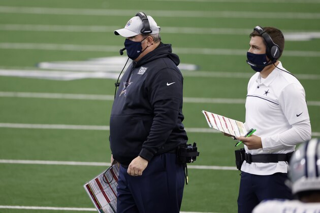 Dallas Cowboys head coach Mike McCarthy, left, and offensive coordinator Kellen Moore, right, watch play from the sideline during the second half of an NFL football game against the Cleveland Browns in Arlington, Texas, Sunday, Oct. 4, 2020. (AP Photo/Ron Jenkins)