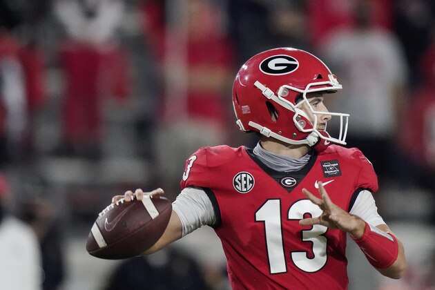 Georgia quarterback Stetson Bennett looks for a receiver during the second half of the team's NCAA college football game against Auburn, Saturday, Oct. 3, 2020, in Athens, Ga. (AP Photo/Brynn Anderson)
