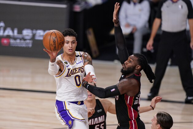 Los Angeles Lakers' Kyle Kuzma (0) passes the ball against during the first half in Game 3 of basketball's NBA Finals, Sunday, Oct. 4, 2020, in Lake Buena Vista, Fla. (AP Photo/Mark J. Terrill)