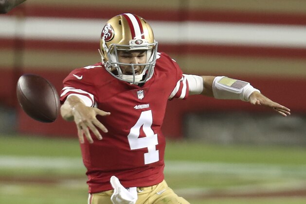 San Francisco 49ers quarterback Nick Mullens (4) fumbles the ball as he runs from Philadelphia Eagles cornerback Cre'von LeBlanc, bottom, which was recovered by defensive tackle Malik Jackson (97), during the second half of an NFL football game in Santa Clara, Calif., Sunday, Oct. 4, 2020. (AP Photo/Jed Jacobsohn)