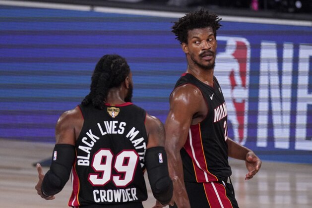 Miami Heat's Jimmy Butler (22) and Miami Heat's Jae Crowder (99) talk between plays during the first half in Game 3 of basketball's NBA Finals against the Los Angeles Lakers, Sunday, Oct. 4, 2020, in Lake Buena Vista, Fla. (AP Photo/Mark J. Terrill) Miami Heat's Jimmy Butler (22) and Miami Heat's Jae Crowder (99) talk between plays during the first half in Game 3 of basketball's NBA Finals against the Los Angeles Lakers, Sunday, Oct. 4, 2020, in Lake Buena Vista, Fla. (AP Photo/Mark J. Terrill)