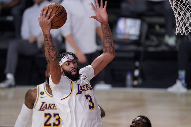 Los Angeles Lakers' Anthony Davis (3) rebound the ball against the Miami Heat during the second half in Game 3 of basketball's NBA Finals, Sunday, Oct. 4, 2020, in Lake Buena Vista, Fla. (AP Photo/Mark J. Terrill)