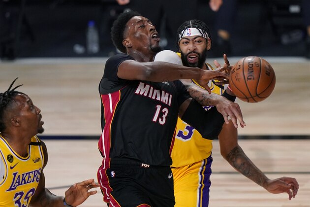 Los Angeles Lakers' Anthony Davis, right, stops Miami Heat's Bam Adebayo (13) on a drive to the basket during the first half of Game 1 of basketball's NBA Finals Wednesday, Sept. 30, 2020, in Lake Buena Vista, Fla. (AP Photo/Mark J. Terrill) Los Angeles Lakers' Anthony Davis, right, stops Miami Heat's Bam Adebayo (13) on a drive to the basket during the first half of Game 1 of basketball's NBA Finals Wednesday, Sept. 30, 2020, in Lake Buena Vista, Fla. (AP Photo/Mark J. Terrill)