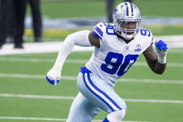 Dallas Cowboys defensive end DeMarcus Lawrence (90) defends during an NFL football game against the Cleveland Browns, Sunday, Oct. 4, 2020, in Arlington, Texas. Cleveland won 49-38. (AP Photo/Brandon Wade) Dallas Cowboys defensive end DeMarcus Lawrence (90) defends during an NFL football game against the Cleveland Browns, Sunday, Oct. 4, 2020, in Arlington, Texas. Cleveland won 49-38. (AP Photo/Brandon Wade)