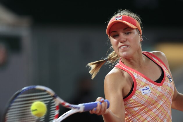 Sofia Kenin of the U.S. plays a shot against France's Fiona Ferro in the fourth round match of the French Open tennis tournament at the Roland Garros stadium in Paris, France, Monday, Oct. 5, 2020. (AP Photo/Michel Euler)