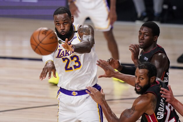 Los Angeles Lakers' LeBron James (23) passes the ball during the first half in Game 3 of basketball's NBA Finals, Sunday, Oct. 4, 2020, in Lake Buena Vista, Fla. (AP Photo/Mark J. Terrill)
