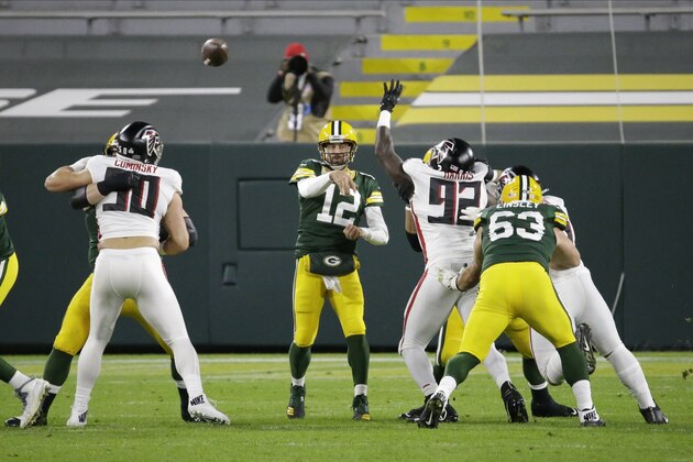 Green Bay Packers' Aaron Rodgers (12) throws during the first half of an NFL football game against the Atlanta Falcons, Monday, Oct. 5, 2020, in Green Bay, Wis. (AP Photo/Mike Roemer)