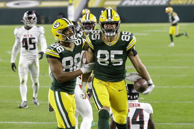 Green Bay Packers' Robert Tonyan (85) celebrates a touchdown reception with Malik Taylor (86) during the first half of an NFL football game against the Atlanta Falcons, Monday, Oct. 5, 2020, in Green Bay, Wis. (AP Photo/Mike Roemer) Green Bay Packers' Robert Tonyan (85) celebrates a touchdown reception with Malik Taylor (86) during the first half of an NFL football game against the Atlanta Falcons, Monday, Oct. 5, 2020, in Green Bay, Wis. (AP Photo/Mike Roemer)