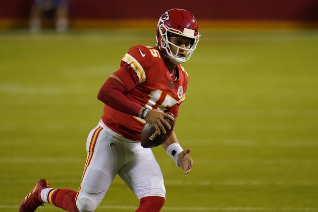 Kansas City Chiefs quarterback Patrick Mahomes (15) runs against the New England Patriots during the second half of an NFL football game, Monday, Oct. 5, 2020, in Kansas City. (AP Photo/Jeff Roberson)