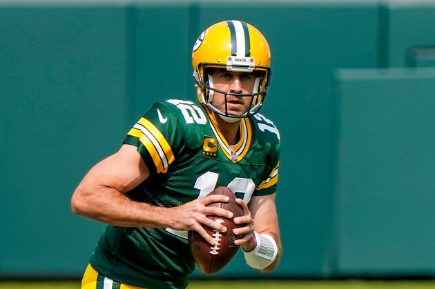 Green Bay Packers' Aaron Rodgers scrambles during the first half of an NFL football game against the Detroit Lions Sunday, Sept. 20, 2020, in Green Bay, Wis. (AP Photo/Morry Gash)