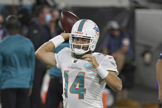 Miami Dolphins quarterback Ryan Fitzpatrick warms up before an NFL football game against the Jacksonville Jaguars, Thursday, Sept. 24, 2020, in Jacksonville, Fla. (AP Photo/Phelan M. Ebenhack)