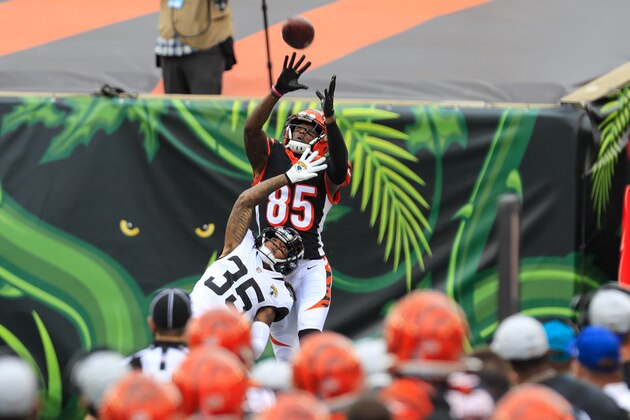 Jacksonville Jaguars running back Devine Ozigbo (35) breaks up a pass intended for Cincinnati Bengals wide receiver Tee Higgins (85) in the first half of an NFL football game in Cincinnati, Sunday, Oct. 4, 2020. (AP Photo/Aaron Doster)