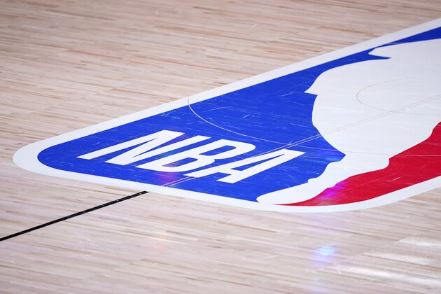 The court floor and league logo are shown after Game 3 of the NBA basketball Western Conference final between the Los Angeles Lakers and Denver Nuggets on Tuesday, Sept. 22, 2020, in Lake Buena Vista, Fla. (AP Photo/Mark J. Terrill) The court floor and league logo are shown after Game 3 of the NBA basketball Western Conference final between the Los Angeles Lakers and Denver Nuggets on Tuesday, Sept. 22, 2020, in Lake Buena Vista, Fla. (AP Photo/Mark J. Terrill)