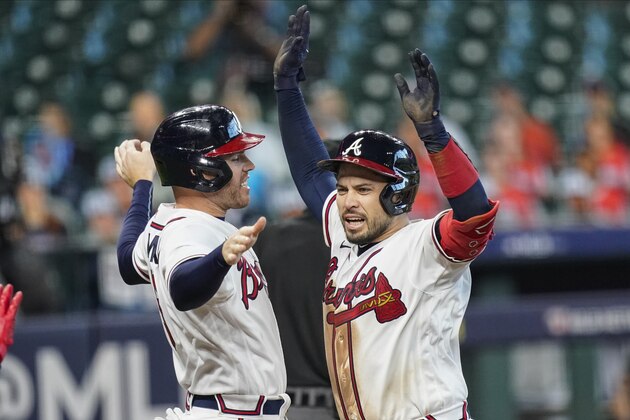 Atlanta Braves' Travis d'Arnaud, right, celebrates with teammate Freddie Freeman after hitting a three-run home run during the seventh inning in Game 1 of a baseball National League Division Series against the Miami Marlins Tuesday, Oct. 6, 2020, in Houston. (AP Photo/Eric Gay) Atlanta Braves' Travis d'Arnaud, right, celebrates with teammate Freddie Freeman after hitting a three-run home run during the seventh inning in Game 1 of a baseball National League Division Series against the Miami Marlins Tuesday, Oct. 6, 2020, in Houston. (AP Photo/Eric Gay)