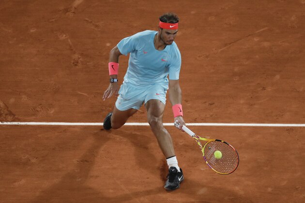 Spain's Rafael Nadal plays a shot against Italy's Jannik Sinner in the quarterfinal match of the French Open tennis tournament at the Roland Garros stadium in Paris, France, Wednesday, Oct. 7, 2020. (AP Photo/Alessandra Tarantino) Spain's Rafael Nadal plays a shot against Italy's Jannik Sinner in the quarterfinal match of the French Open tennis tournament at the Roland Garros stadium in Paris, France, Wednesday, Oct. 7, 2020. (AP Photo/Alessandra Tarantino)