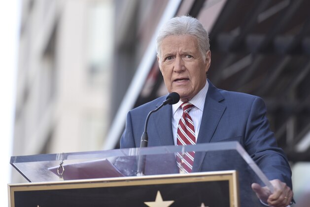 Alex Trebek speaks at a ceremony honoring Harry Friedman, executive producer of
